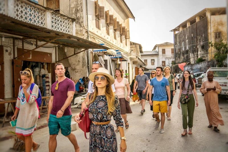 Tourist enjoying Stone Town + Prison Island + Nakupenda Sandbank in Zanzibar - Cultural & Historical tour experience